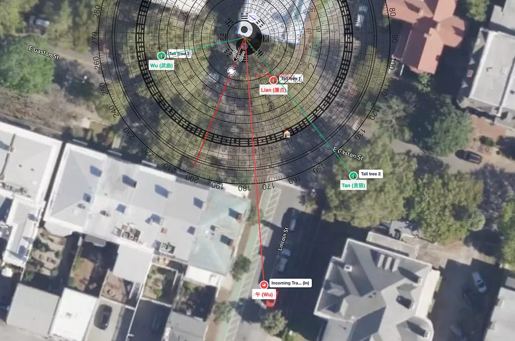 Satellite overview - south-facing Savannah property with 24 Mountains compass overlay showing four mapped objects (three tall trees and one incoming traffic road) and main energy entrance arrow. Alt text: "feng shui home satellite overview with compass overlay showing four landscape features mapped on south-facing Savannah Georgia property 2026"